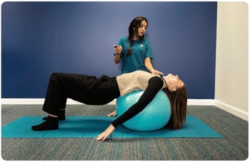 Brain Balance coach leading student through exercies.