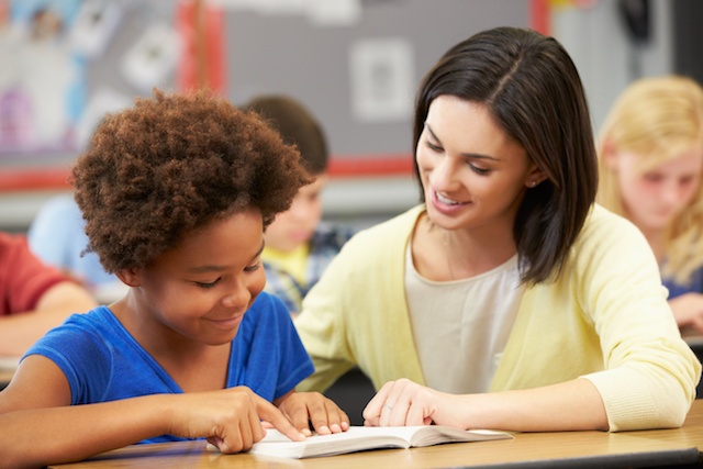 teacher helping reluctant reader